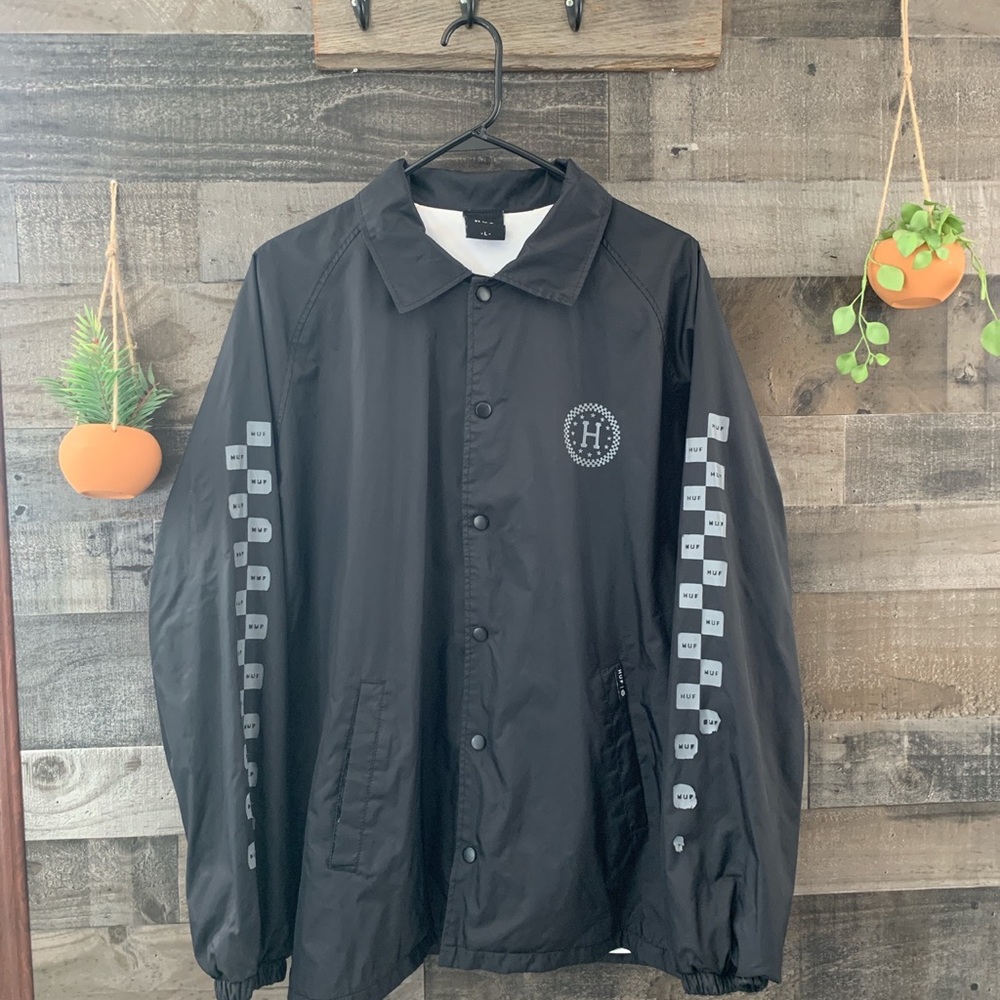 HUF windbreaker size large some flaking on sleeves